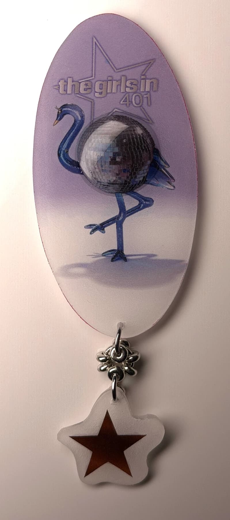 Disco bird charm with a dangling star