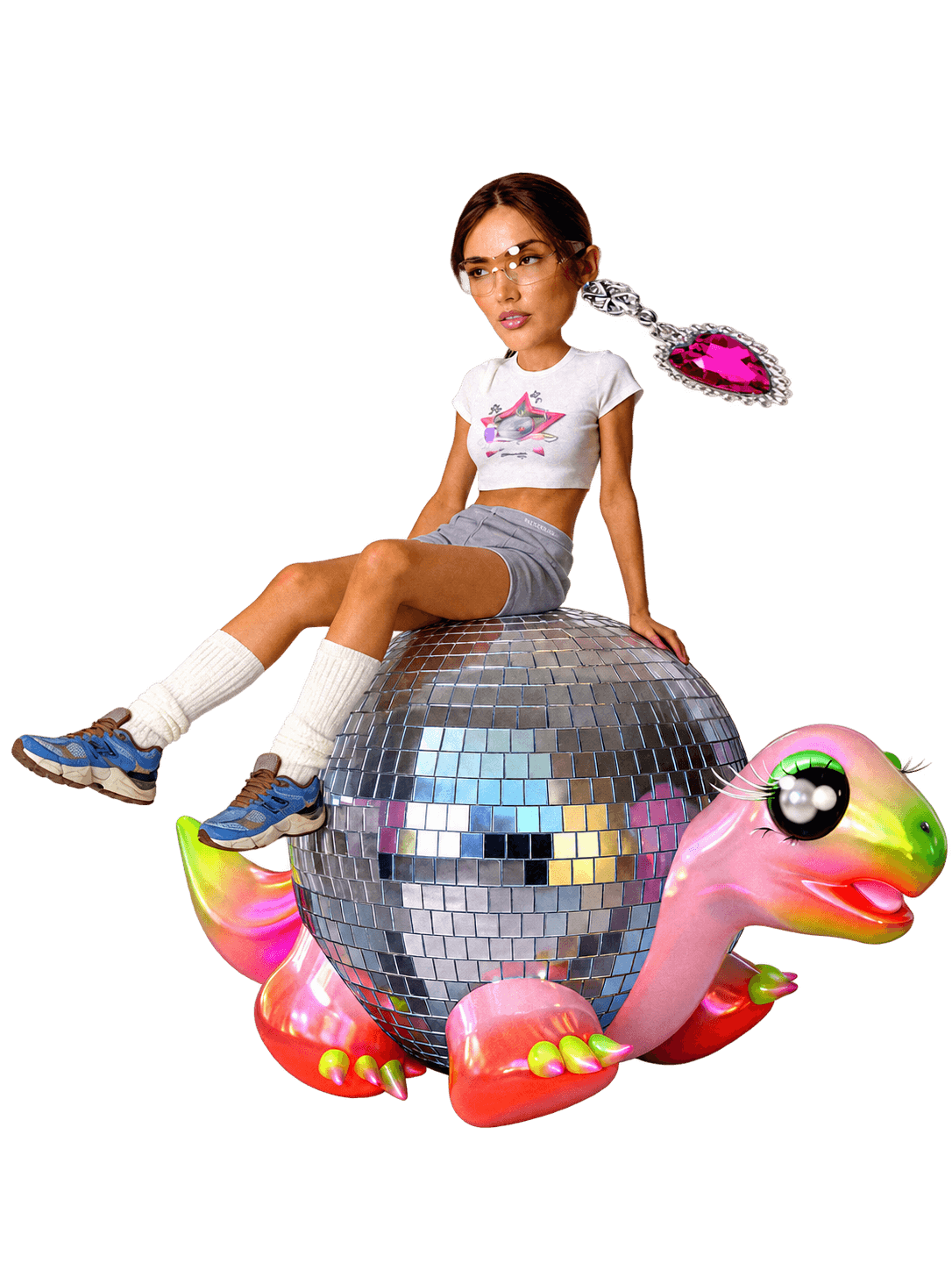 Hailee sitting on Gus, the colorful turtle with a mirrored disco-ball shell
