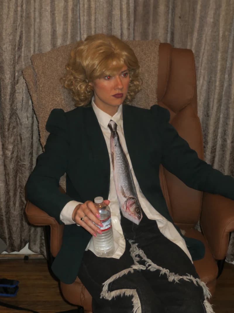 Abbey wearing the Branzino Tie with a dark blazer